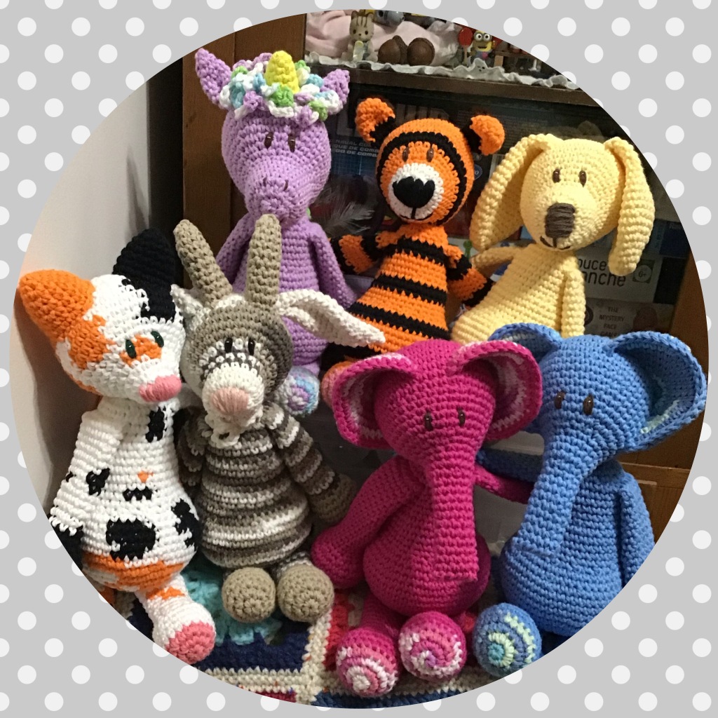 Lots of crochet stuffed animals from Edward's Menagerie book (unicorn, tiger, pup, cat, goat, elephants)