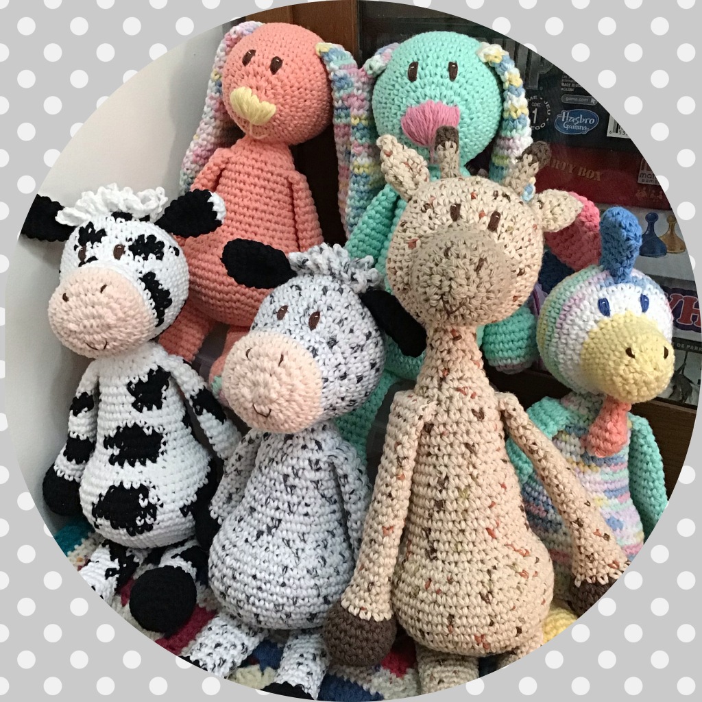 Group picture of modified Edward's Menagerie stuffies (bunnies, cows, giraffe, rooster)