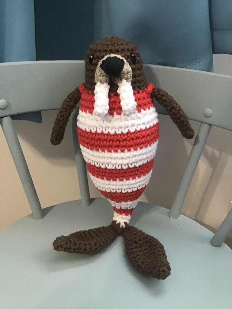 Walrus stuffie in an old time bathing costume 