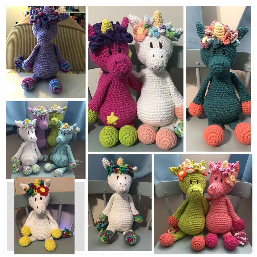 Lots of large unicorn stuffies in lots of colours