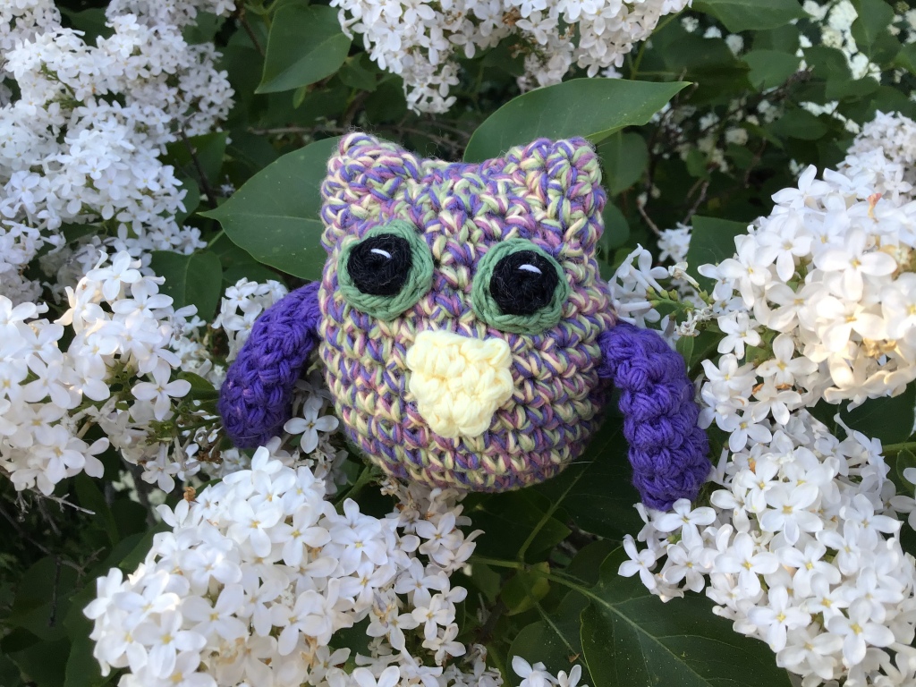 Tiny horned owl in purple vintage colours