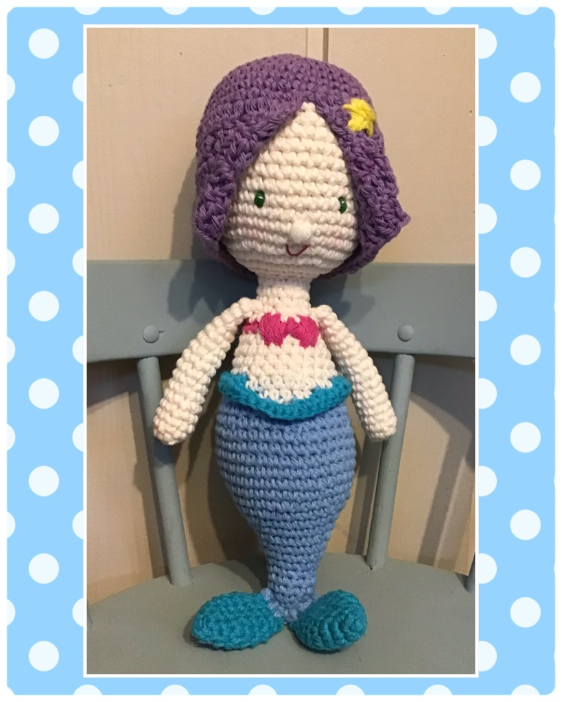 Mermaid stuffie doll with purple hair