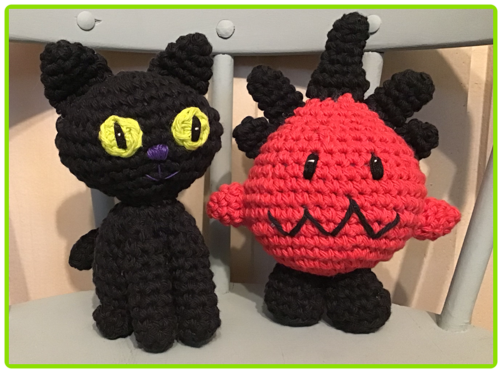Black cat and radish monster stuffies