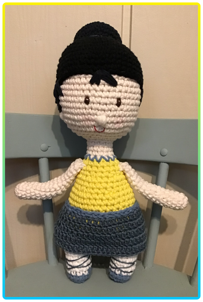 Ballerina doll in yellow and blue outfit