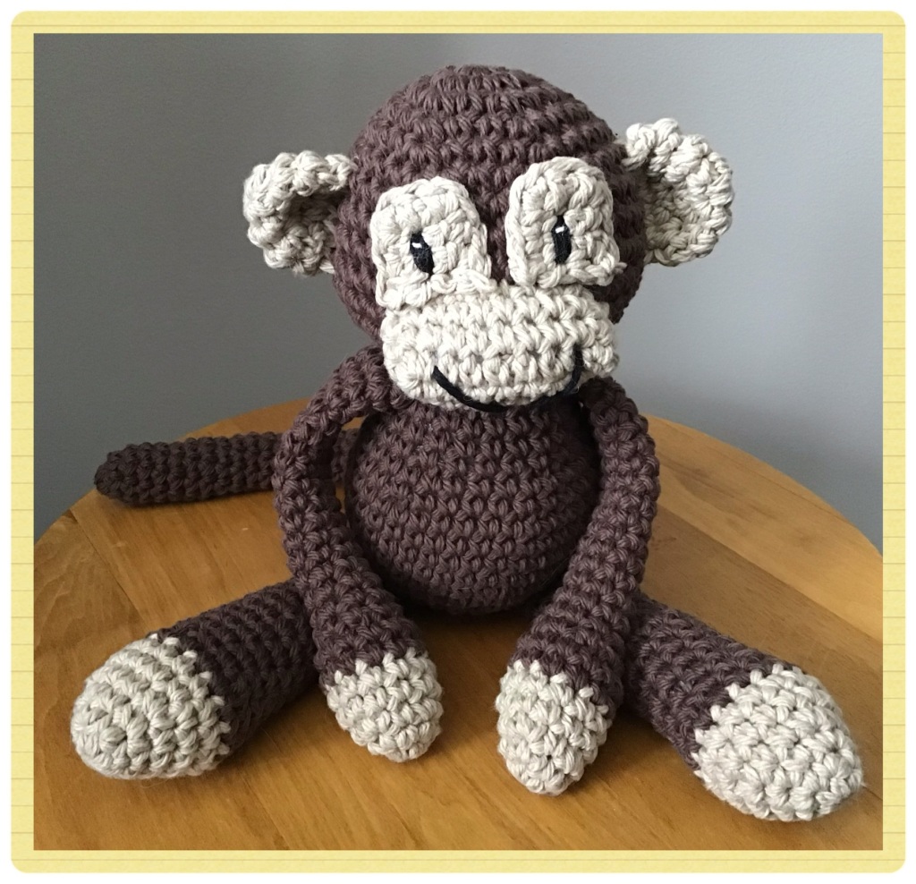 Monkey stuffie sitting on a table