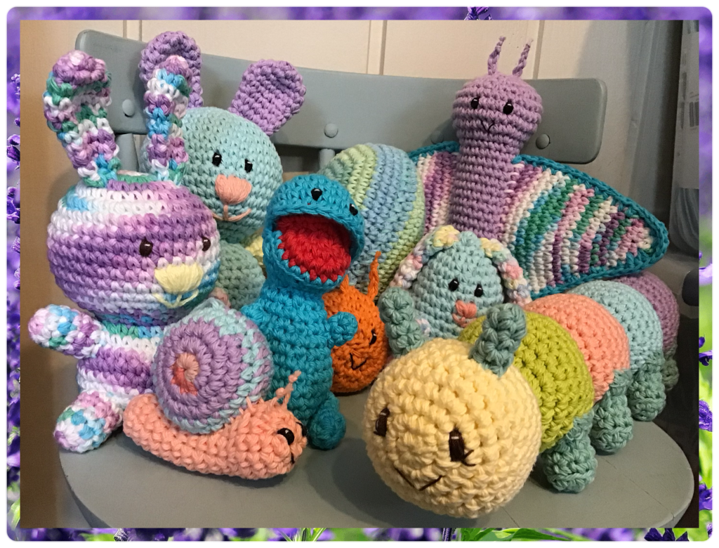 2 bunnies, 2 snails, baby t-rex with open mouth, eggy bunny, butterfly, and caterpillar 