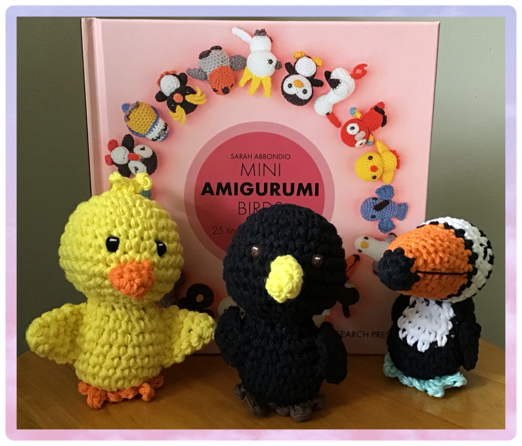 Chick, blackbird, and toucan from "Mini Amigurumi Birds by Sarah Abbondio". The book is in the picture too
