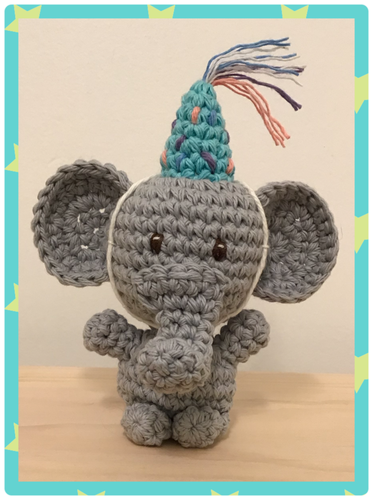 Little birthday elephant crochet stuffie. This little elephant has a party hat