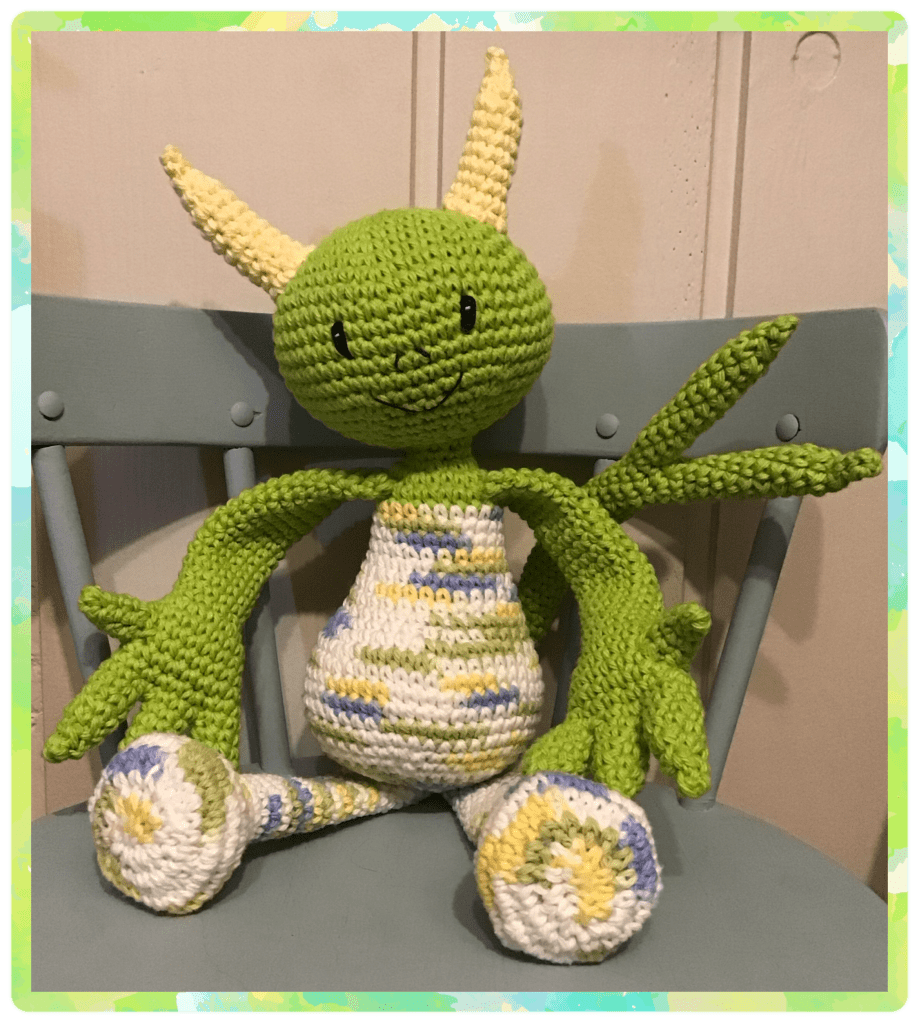 Cam is a goblin like monster with lime green and mix colours