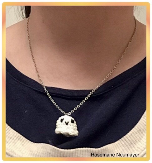 Ghost crochet charm on a necklace