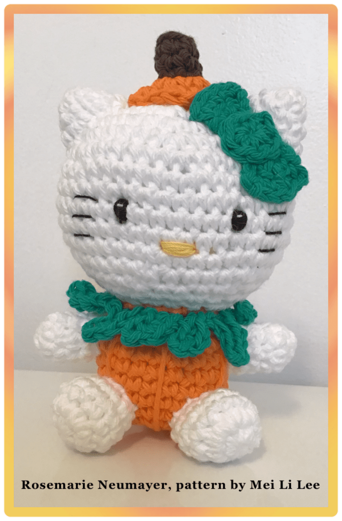 Hello kitty in a pumpkin costume 