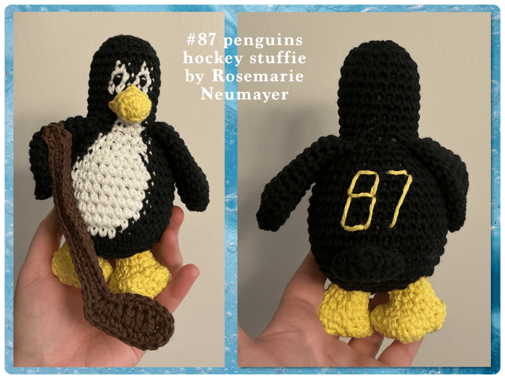 A penguin playing hockey stuffie for the team "the penguins" with #87 on it's back.